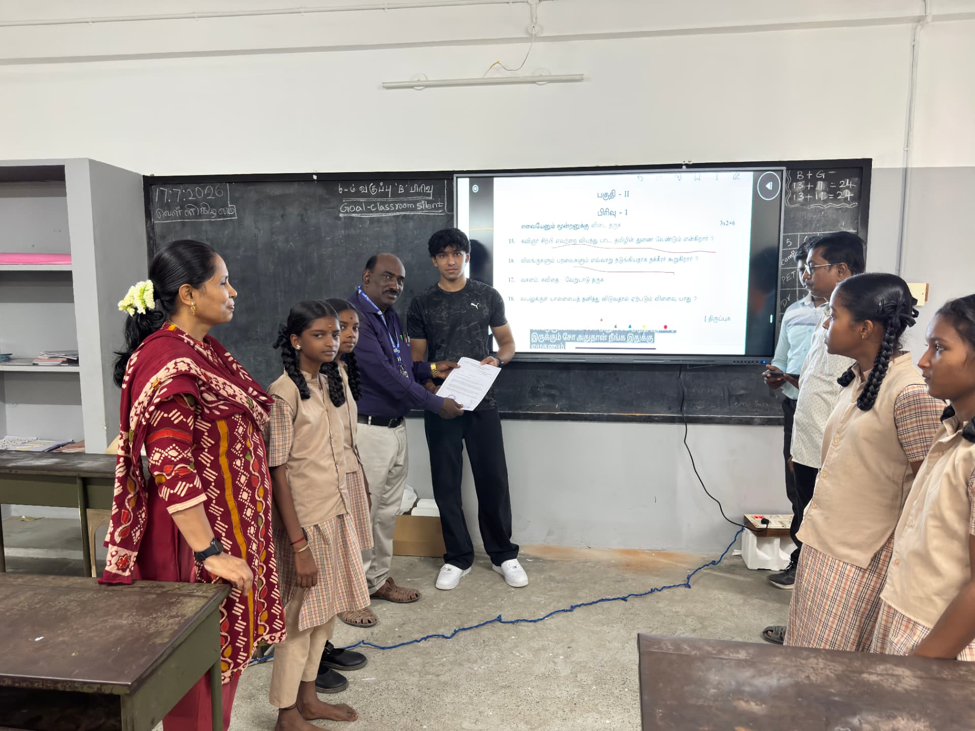 Handing over the smart board to teachers and students at Naickenpalayam